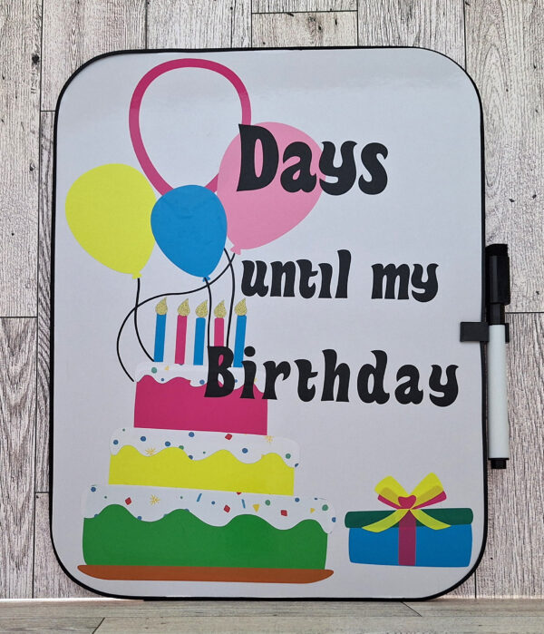 Dry erase whiteboard with a birthday cake, balloons, and "Days until my birthday" text.