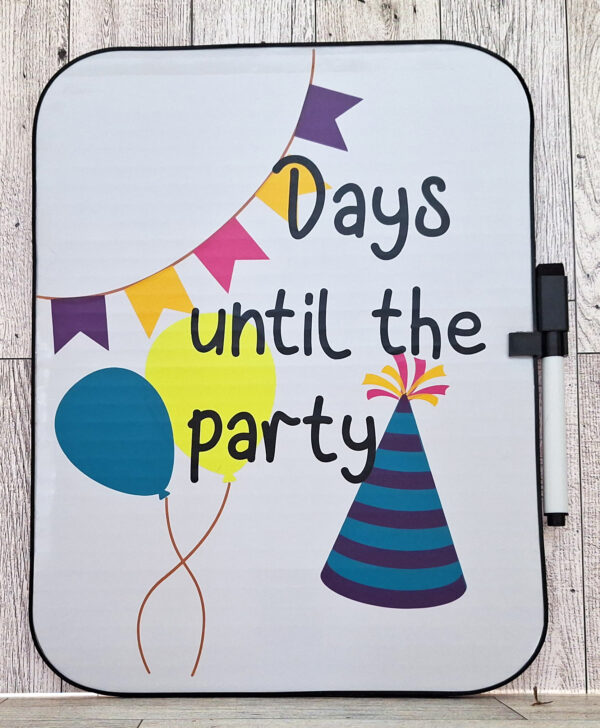 Whiteboard with party hats and balloons with the text "days until the party"