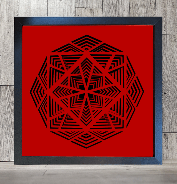 Geometric design cut into layers of red and black paper
