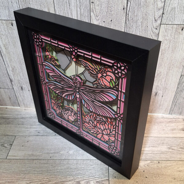 Angled view of dragonfly shadowbox so you can see the layers