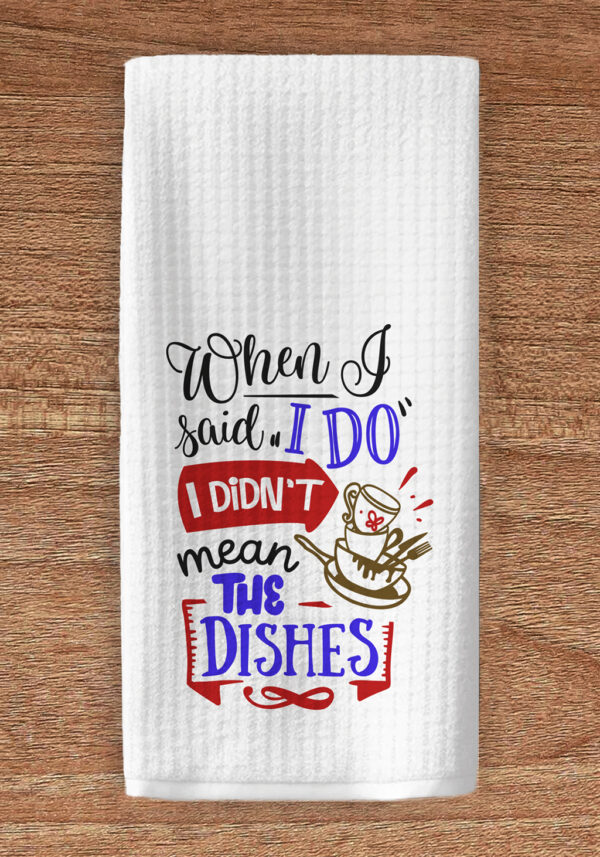 Kitchen towel imprinted with a graphic of dishes and the title text