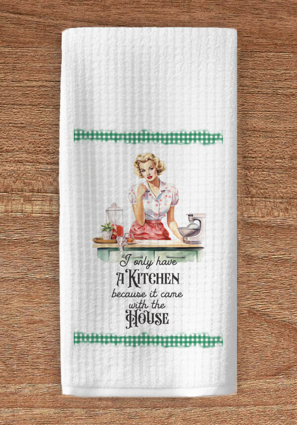Kitchen towel imprinted with vintage housewife and title text