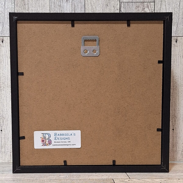 Back view of framed art in black frame